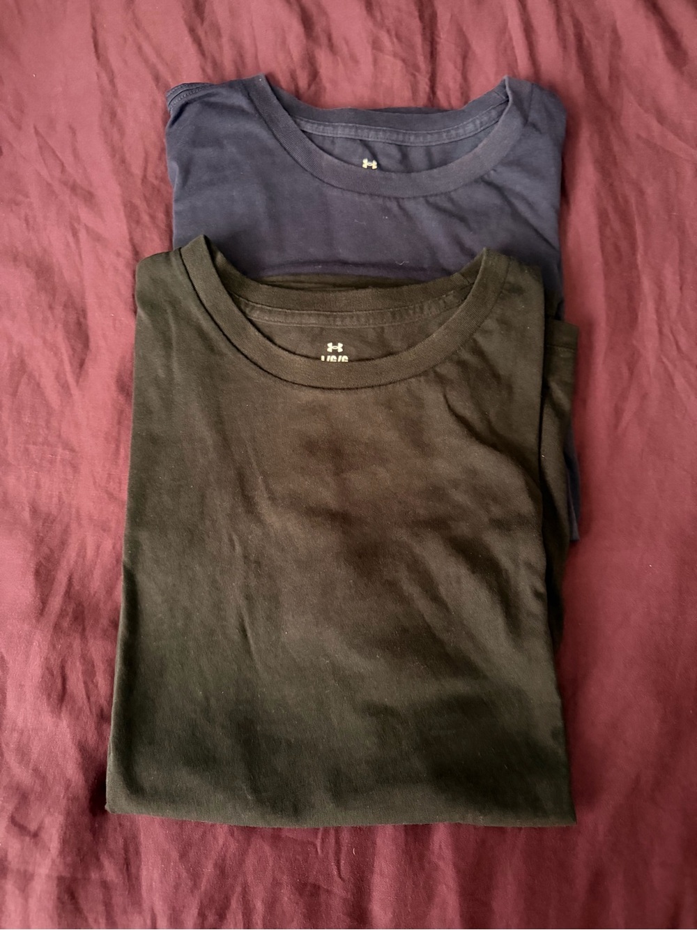 Under Armour women’s blue and black Crew Neck T-Shirts